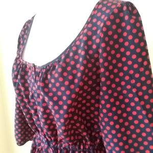 A navy & red polkadot dress with drawstring waist.